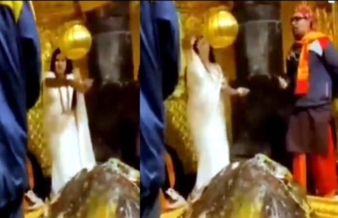 woman blowing notes in Kedarnath